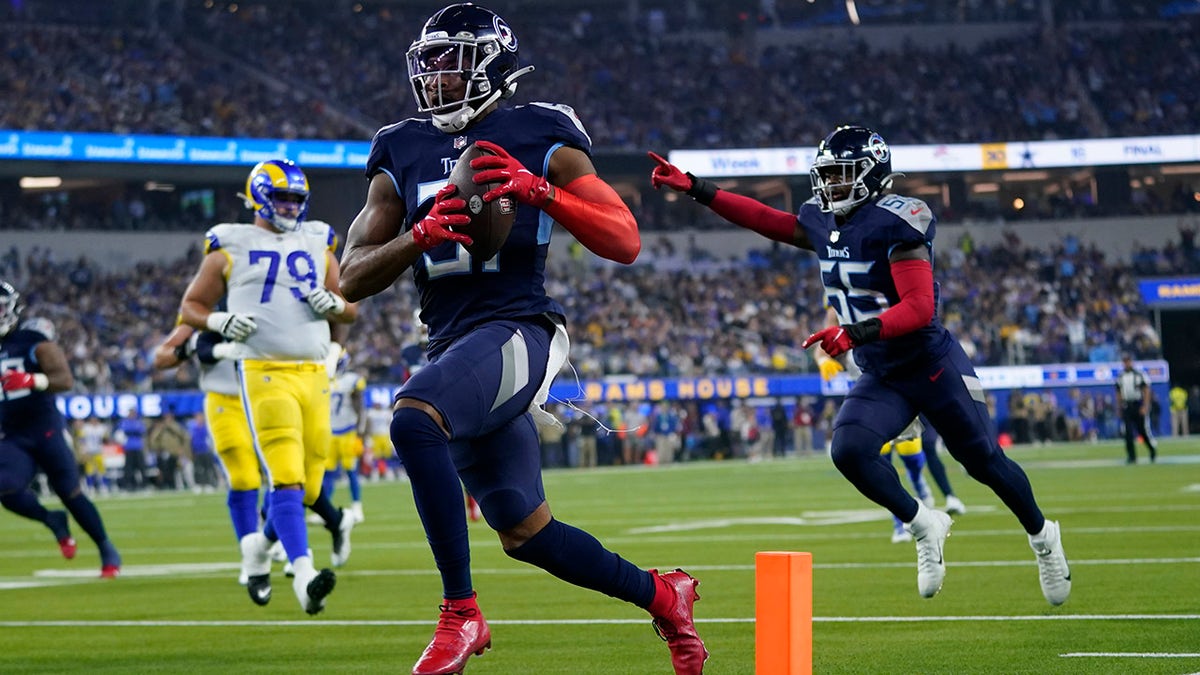 Tennessee Titans free safety Kevin Byard scores a touchdown after grabbing an interception during the first half of an NFL football game against the Los Angeles Rams Sunday, Nov. 7, 2021, in Inglewood, Calif.