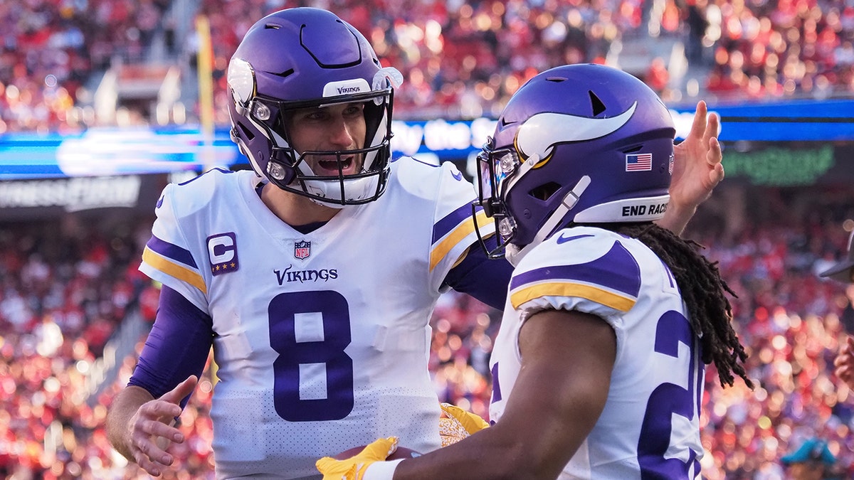 Nov 28, 2021; Santa Clara, California, USA; Minnesota Vikings quarterback Kirk Cousins (8) celebrates with running back Alexander Mattison (25) after a touchdown during the third quarter at Levi's Stadium.