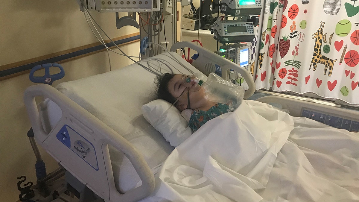 Kyla Luzader in a hospital bed Feb. 9, 2020.