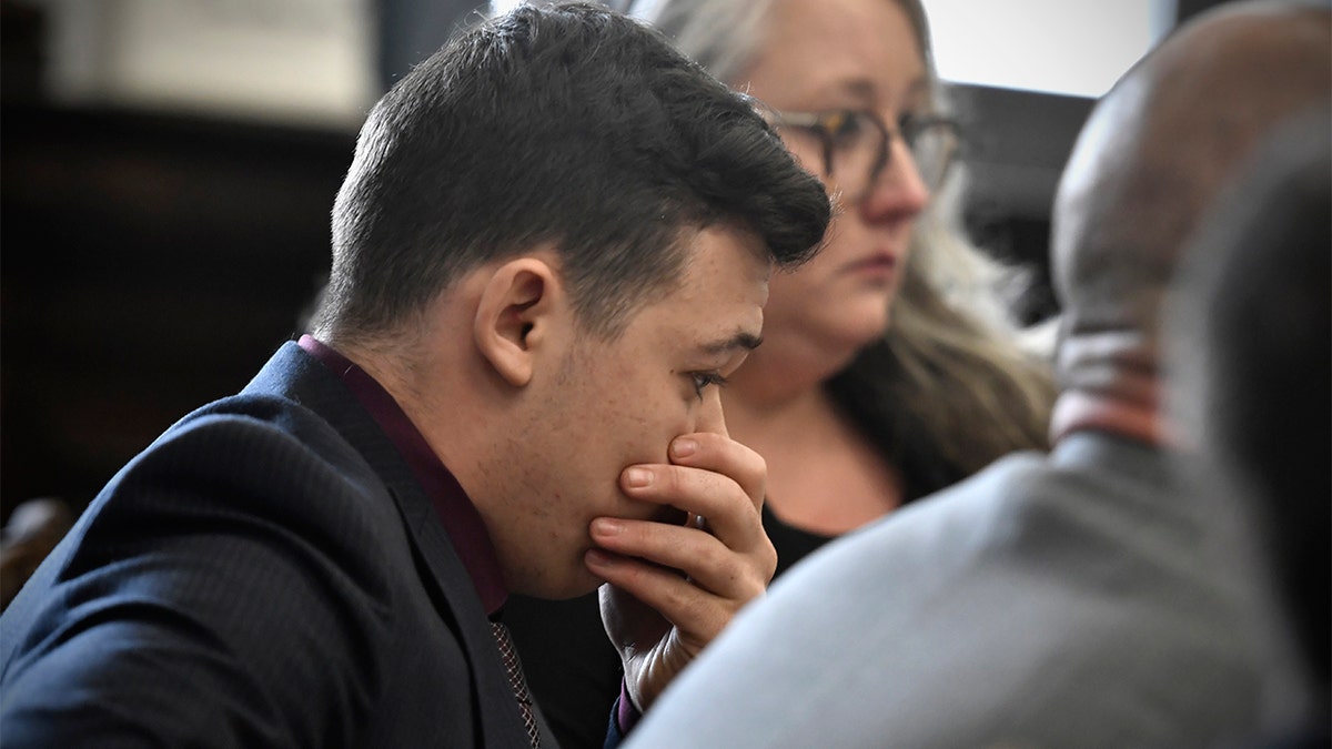 Kyle Rittenhouse puts his hand over his face after he is found not guilty on all counts at the Kenosha County Courthouse in Kenosha, Wis., on Friday, Nov. 19, 2021.  The jury returned with its verdict after about 3 1/2 days of deliberations. 