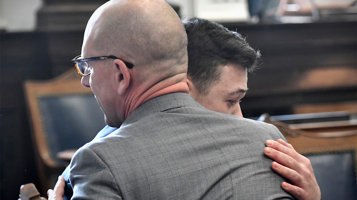 Kyle Rittenhouse hugs one of his attorneys, Corey Chirafisi, after he is found not guilt on all counts at the Kenosha County Courthouse in Kenosha, Wis., on Friday, Nov. 19, 2021. (Sean Krajacic/The Kenosha News via AP, Pool)