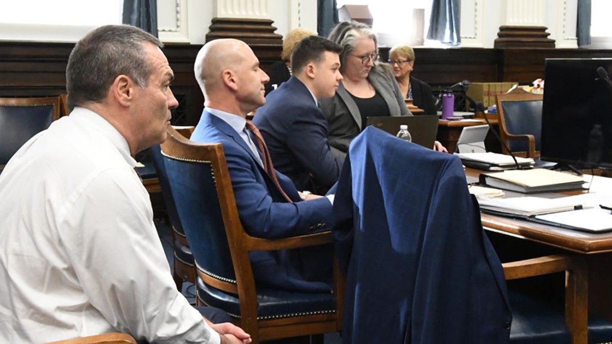 KENOSHA, WISCONSIN - NOVEMBER 10: Kyle Rittenhouse (3rd L) sits with his defense team, Mark Richards (L), Corey Chirafisi (2nd L) and Natalie Wisco during his trial at the Kenosha County Courthouse on November 10, 2021 in Kenosha, Wisconsin. (Photo by Mark Hertzberg-Pool/Getty Images)