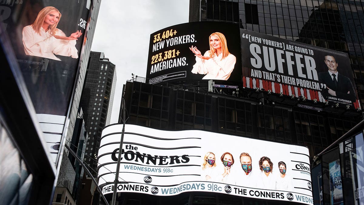 Images of Ivanka Trump and Jared Kushner alongside messages about coronavirus disease (COVID-19) infections and deaths on billboards sponsored by The Lincoln Project above Times Square in New York City, Oct. 24, 2020.