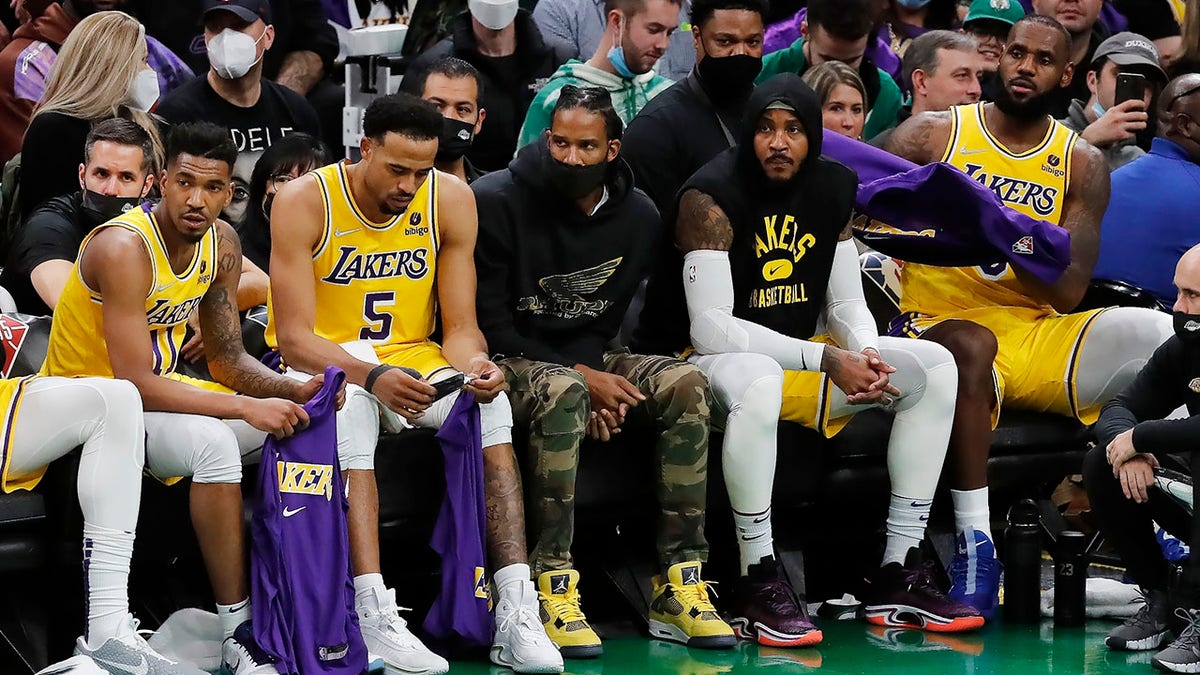 The Los Angeles Lakers bench looks on during the second half of an NBA basketball game against the Boston Celtics, Friday, Nov. 19, 2021, in Boston.