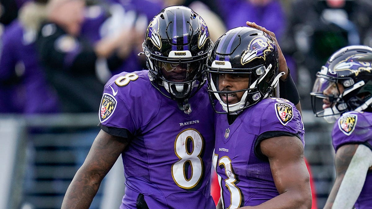 Ravens quarterback Lamar Jackson (8) and wide receiver Devin Duvernay celebrate a touchdown against the Minnesota Vikings, on Nov. 7, 2021, in Baltimore.