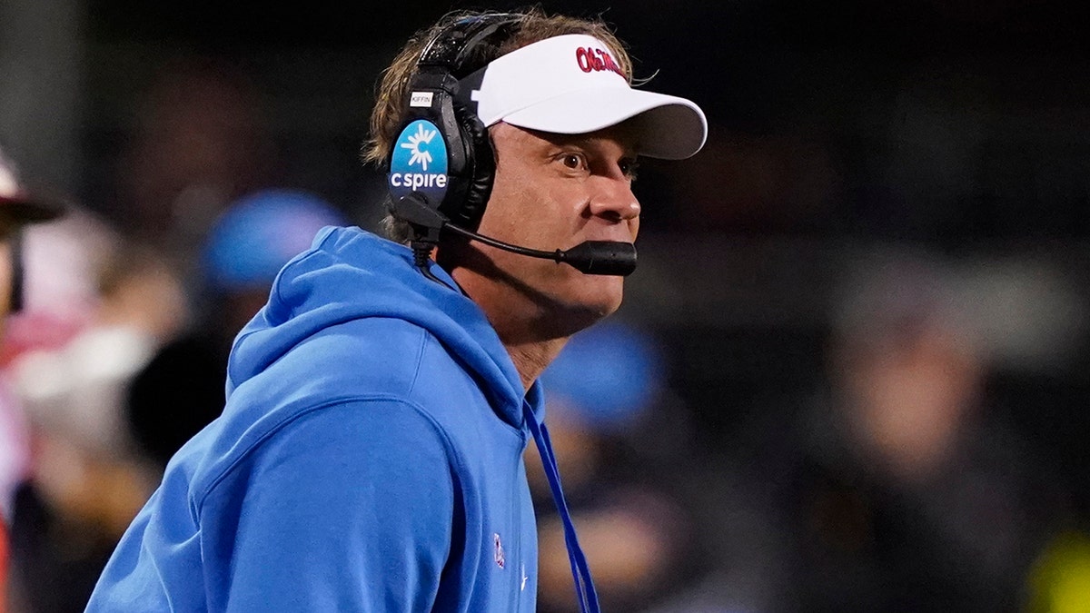 Mississippi coach Lane Kiffin calls out to players during the second half of the team's NCAA college football game against Mississippi State, Thursday, Nov. 25, 2021, in Starkville, Mississippi. 