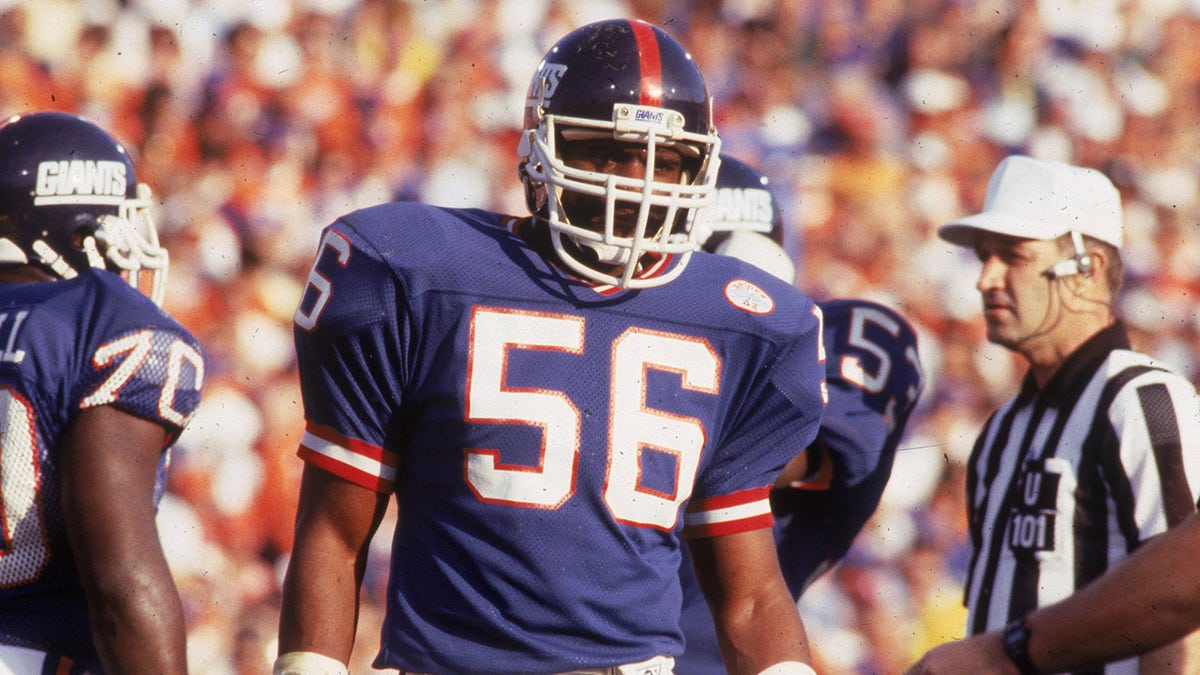 PASADENA - JANUARY 25 :  Linebacker Lawrence Taylor #56 of the New York Giants looks over to the sideline against the Denver Broncos in Super Bowl XXlI at the Rose Bowl on January 25, 1987 in Pasadena, California. The Giants defeated the Broncos 39-20.