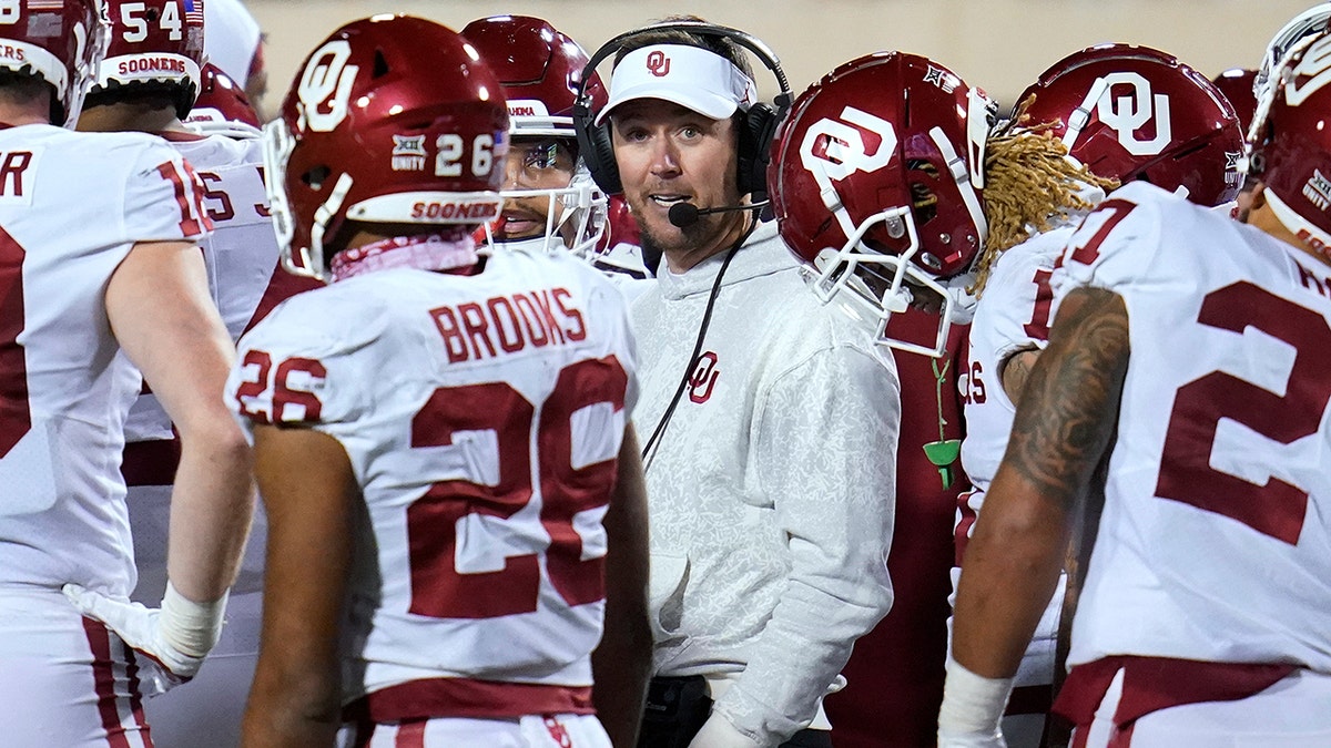 Oklahoma head coach Lincoln Riley talks with his players during a game against Oklahoma State, Saturday, Nov. 27, 2021, in Stillwater, Okla.