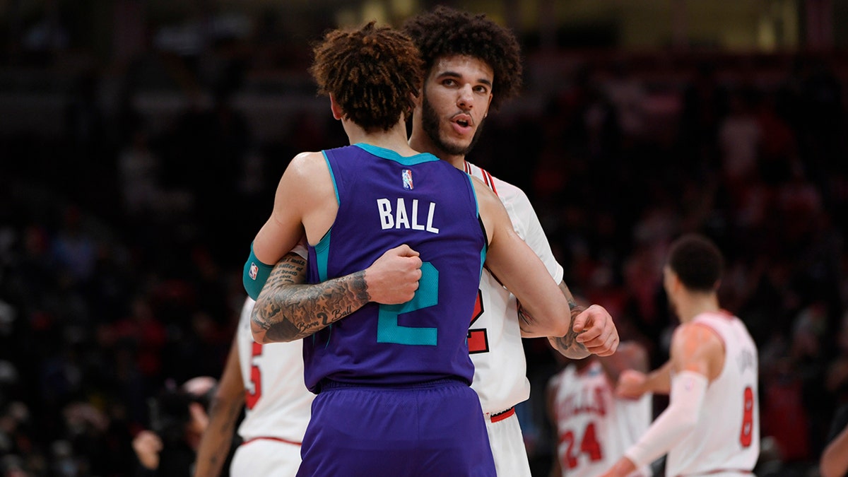 Lonzo Ball hugs brother LaMelo Ball after an NBA game