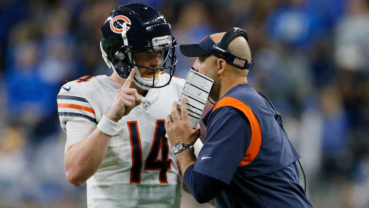 Chicago Bears quarterback Andy Dalton talks with head coach Matt Nagy during the second half of an NFL football game against the Detroit Lions, Thursday, Nov. 25, 2021, in Detroit. 