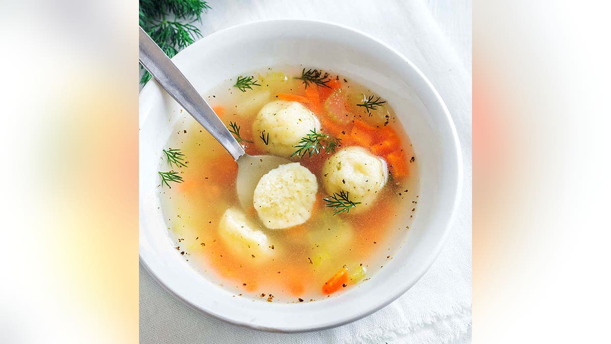 Delicious Matzoh ball soup Jewish traditional cuisine, homemade Matzo Ball soup with vegetables