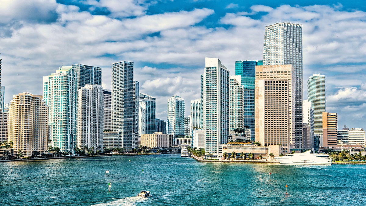 Miami skyline. Yachts sail on sea water to city Miami, Florida (iStock)