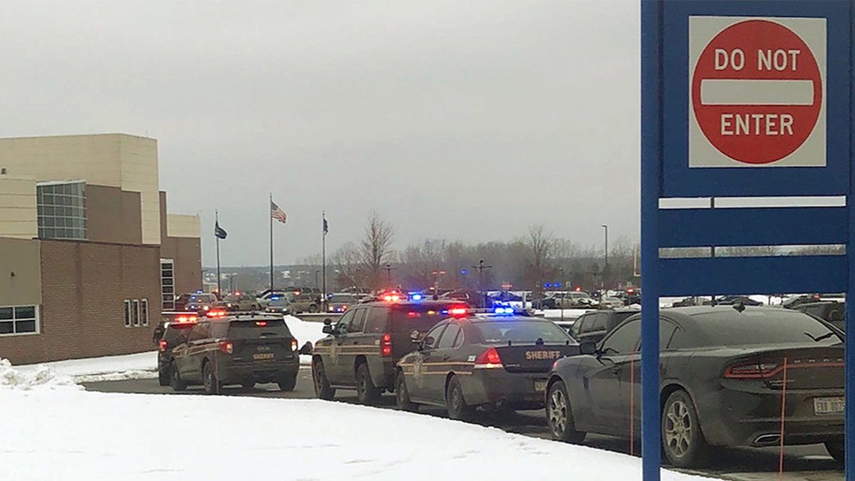 Police cars outside Oxford High School in Oxford, Michigan after shooting