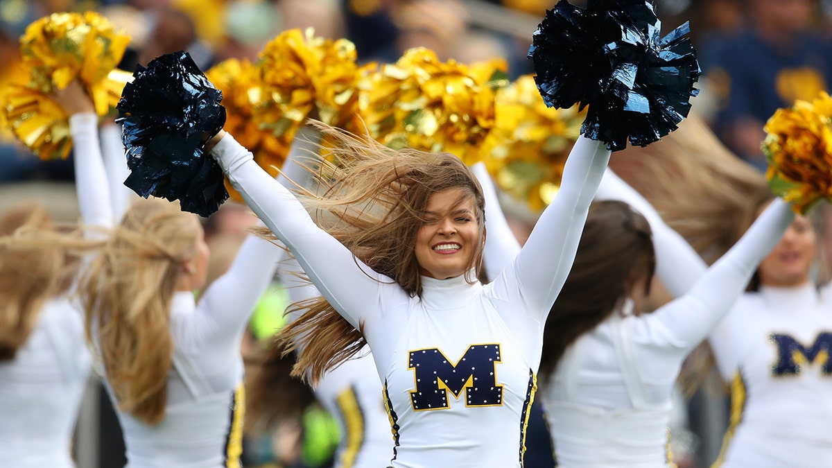 A member of the Michigan Wolverines dance team performs while playing the Iowa Hawkeyes at Michigan Stadium on Oct. 5, 2019, in Ann Arbor, Michigan.