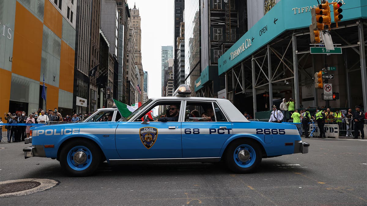 A New York Police Department vehicle makes its way along Fifth Avenue during the Columbus Day Parade in New York City, U.S., October 11, 2021. REUTERS/Shannon Stapleton