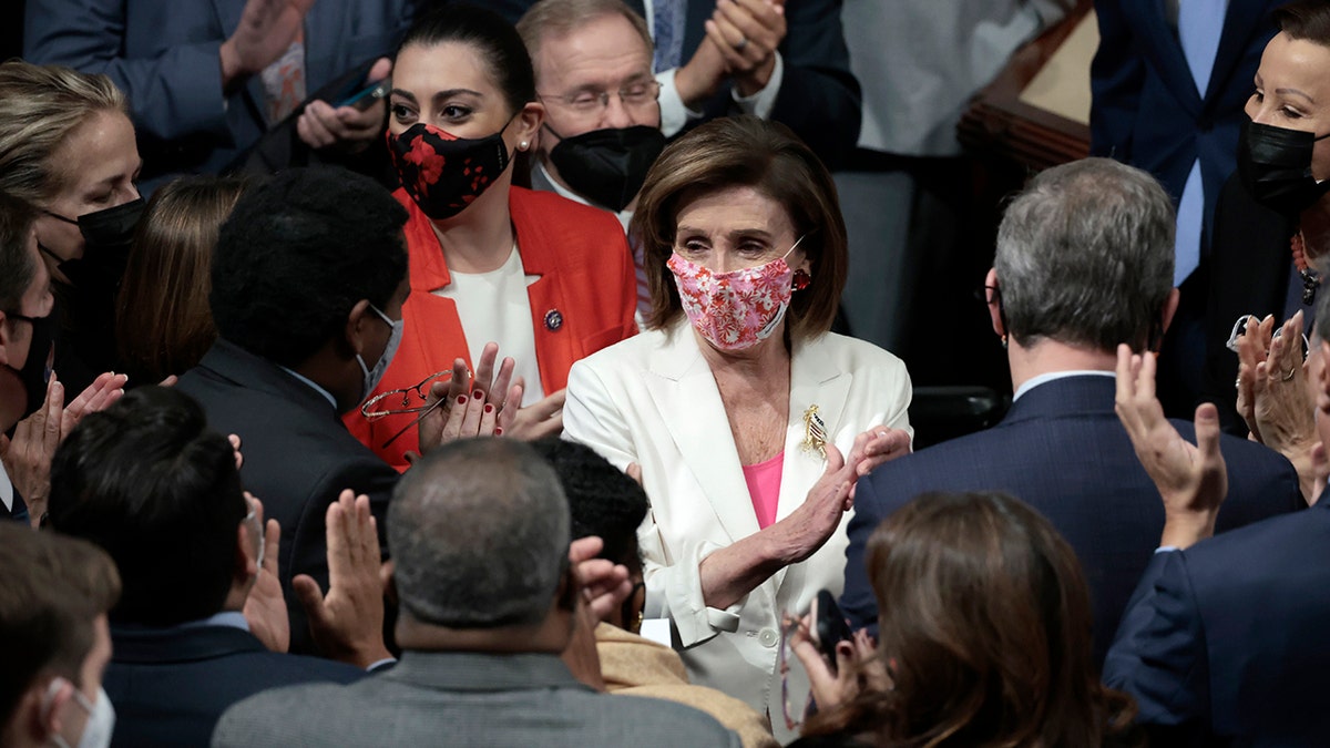  Speaker of the House Nancy Pelosi cheers with House Democrats after the passage of the Build Back Better Act at the U.S. Capitol on November 19, 2021 in Washington, DC. (Photo by Anna Moneymaker/Getty Images)