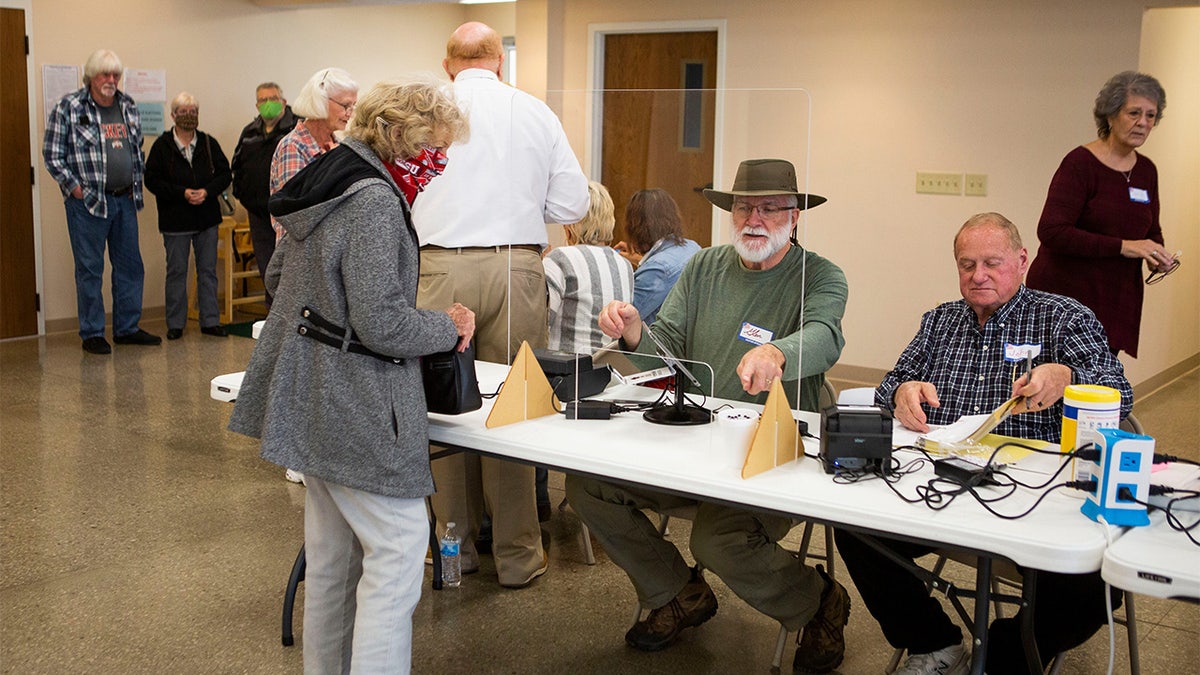 Voters cast their ballots at poling locations in Newark and Heath, Ohio, on Election Day on November 2, 2021.