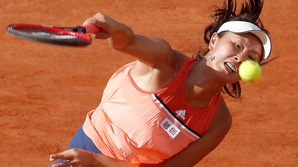 FILE: China's Shuai Peng serves the ball to France's Caroline Garcia during their second round match of the French Open tennis tournament at the Roland Garros stadium, Thursday, May 31, 2018, in Paris.