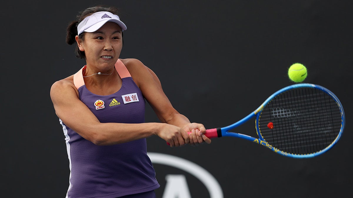 MELBOURNE, AUSTRALIA - JANUARY 23: Shuai Peng of China plays a backhand during her Women's Doubles first round match with partner Shuai Zhang of China against Veronika Kudermetova of Russia and Alison Riske of the United States on day four of the 2020 Australian Open at Melbourne Park on January 23, 2020 in Melbourne, Australia.