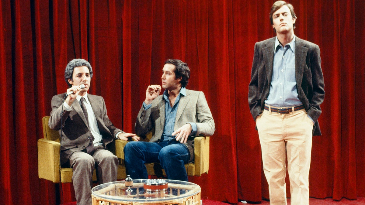 Harry Shearer as Mr. Blackwell, Chevy Chase and Peter Aykroyd as model during the "Speaking of Fashion...and other things" skit on Feb. 9, 1980.