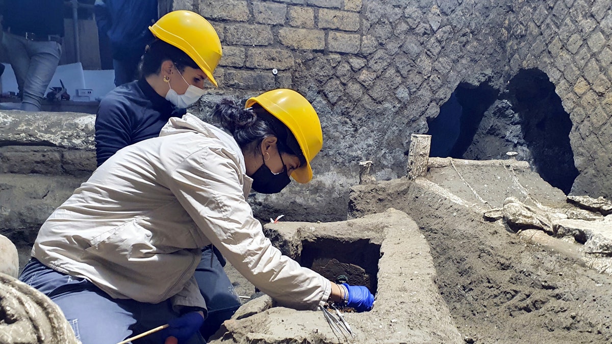 Archeologist clean up their latest finding in Pompeii, Italy. Archeologists, excavating a villa amid the ruins of the 79 A.D. volcanic eruption, have discovered a room that served as both a dormitory and storage area, which officials said Saturday offered "a very rare insight the daily life of slaves." Italy’s culture minister, Dario Franceschini, said the find was "an important discovery that enriches the knowledge of the daily life of ancient Pompeiians, in particular the level of society still little known."