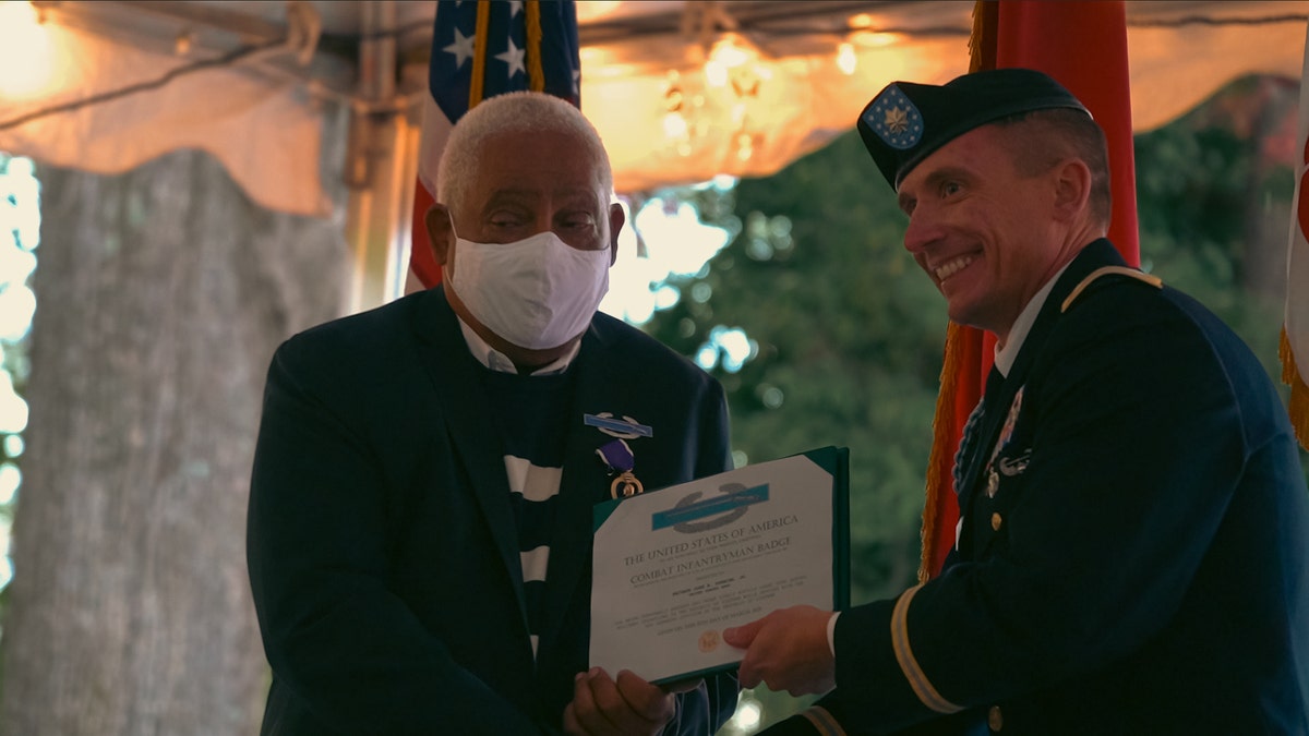 John Spencer Jr. given a Purple Heart, the Combat Infantryman Badge and the Republic of Vietnam Gallantry Cross at the University of North Carolina School of Law for his service. 