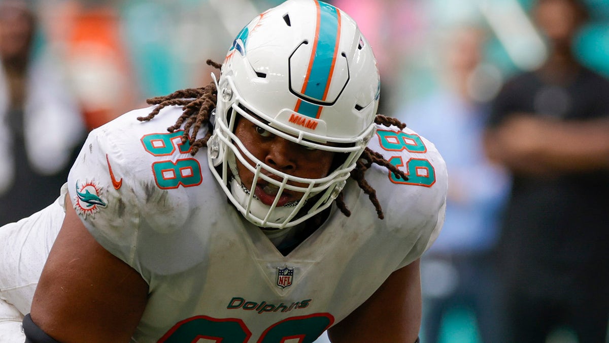 Miami Dolphins offensive lineman Robert Hunt (68) runs onto the field as he  is introduced to the fans before an NFL football game between the Houston  Texans and the Miami Dolphins, Sunday