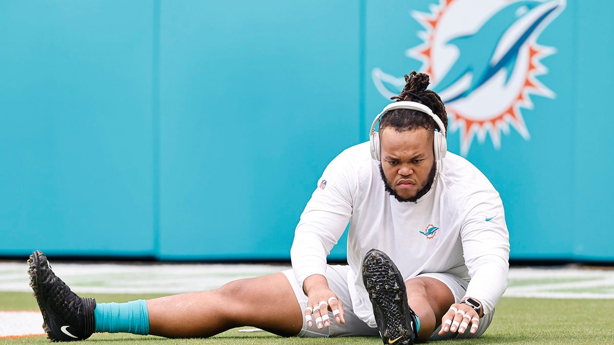 MIAMI GARDENS, FLORIDA - OCTOBER 24: Robert Hunt #68 of the Miami Dolphins stretches prior to the game against the Atlanta Falcons at Hard Rock Stadium on October 24, 2021 in Miami Gardens, Florida.