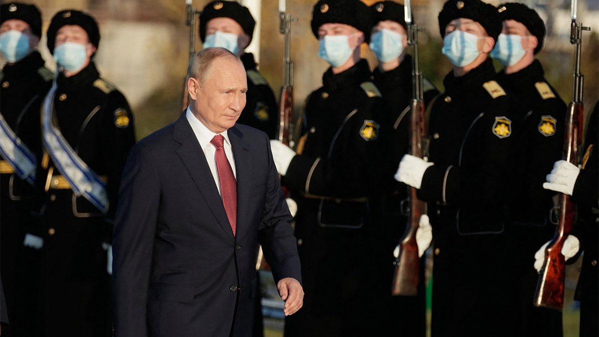 Russian President Vladimir Putin attends a flower-laying ceremony at the Russian Civil War memorial on Unity Day, in Sevastopol, Crimea, on Nov. 4, 2021. (Photo by MIKHAIL METZEL/SPUTNIK/AFP via Getty Images)