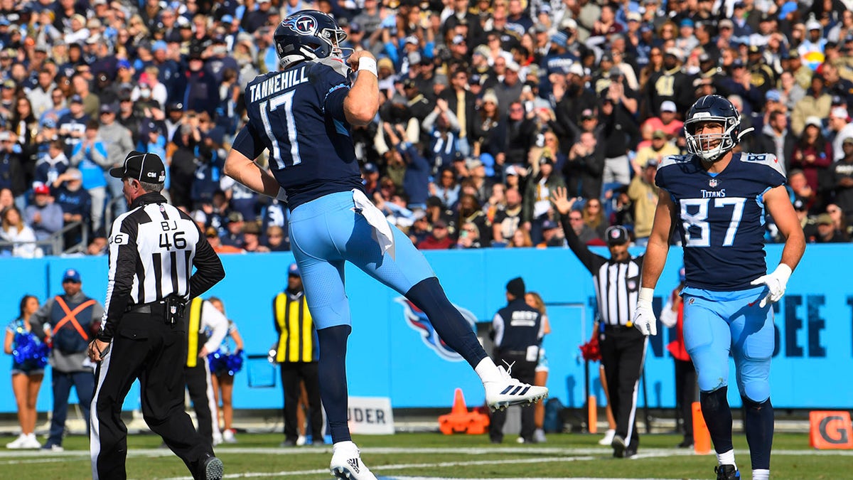 Tennessee Titans quarterback Ryan Tannehill (17) celebrates after scoring a touchdown against the New Orleans Saints in the first half of an NFL football game Sunday, Nov. 14, 2021, in Nashville, Tennessee.