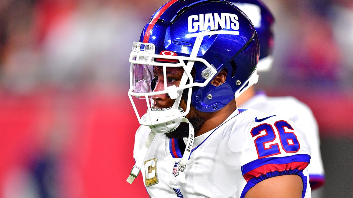 Saquon Barkley #26 of the New York Giants looks on during warmups before the game against the Tampa Bay Buccaneers at Raymond James Stadium on Nov. 22, 2021 in Tampa, Florida.