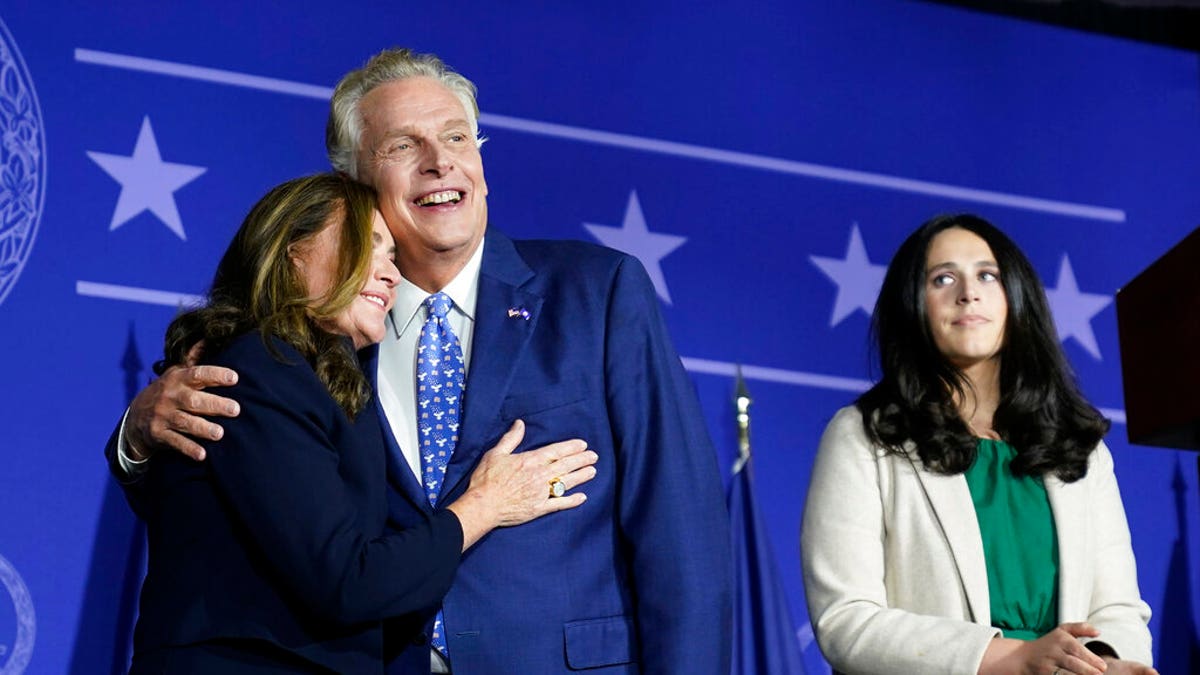 Democratic gubernatorial candidate Terry McAuliffe, right, hugs his wife, Dorothy, as he makes an appearance at an election night party in McLean, Virginia, Tuesday, Nov. 2, 2021. 