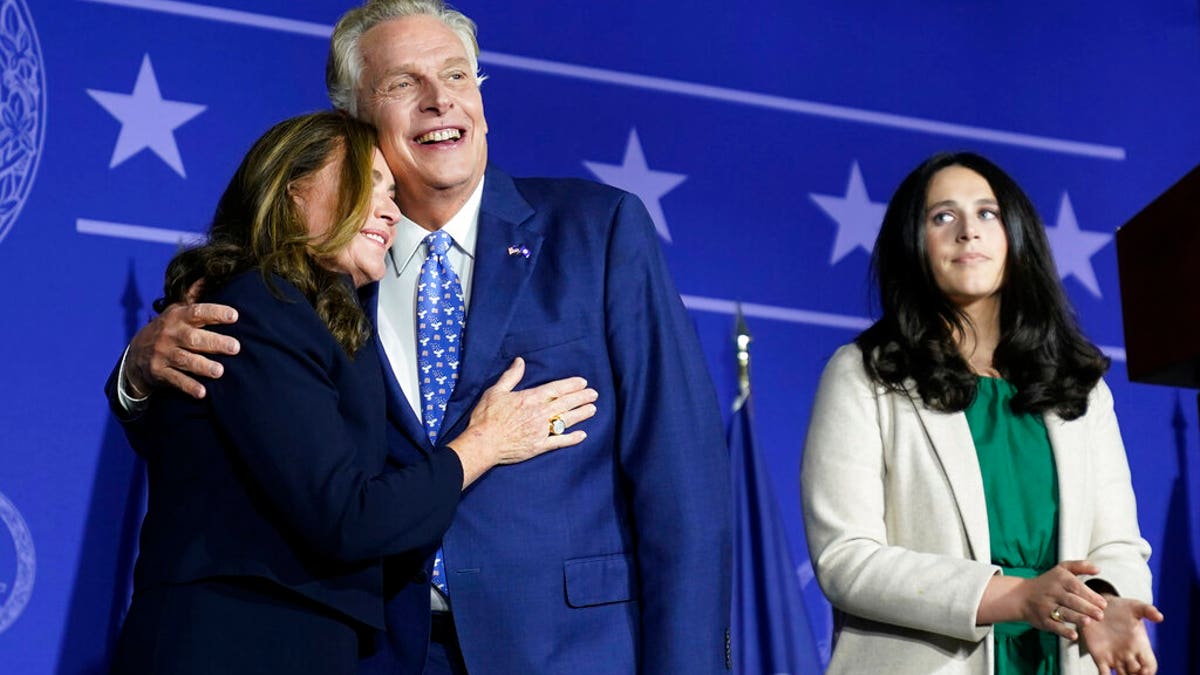 Democratic gubernatorial candidate Terry McAuliffe, right, hugs his wife, Dorothy, as he makes an appearance at an election night party in McLean, Virginia, Tuesday, Nov. 2, 2021. 