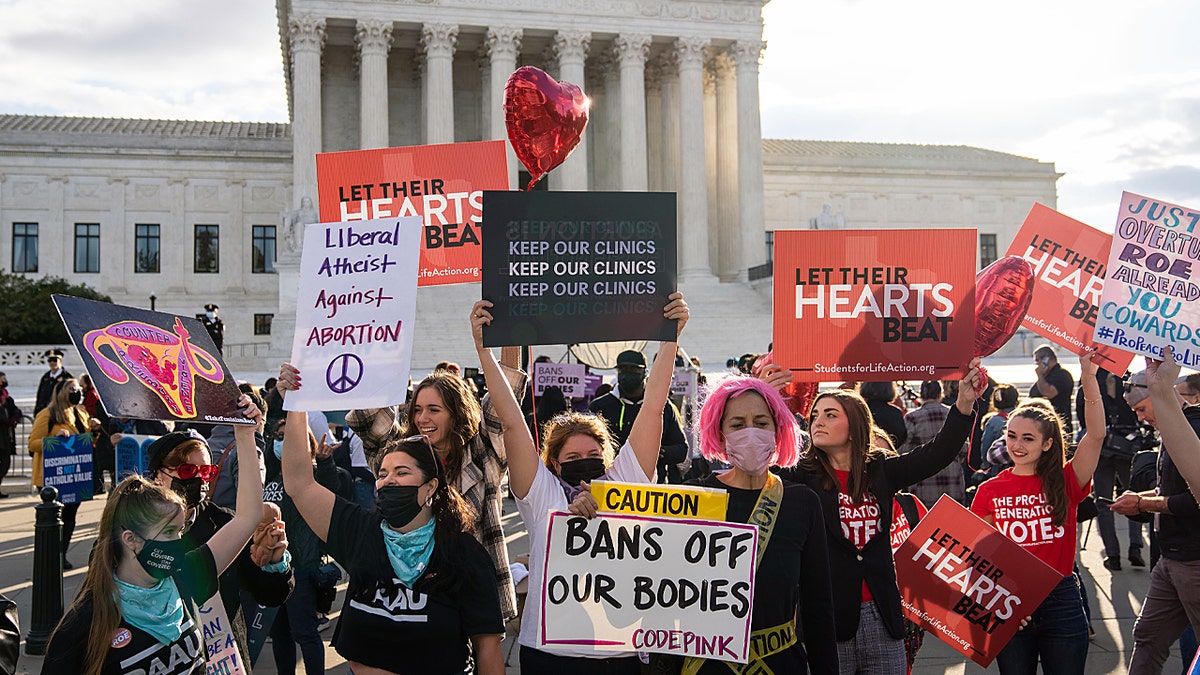 Pro-choice and anti-abortion demonstrators rally outside the U.S. Supreme Court on Nov. 1, 2021, in Washington, D.C. 
