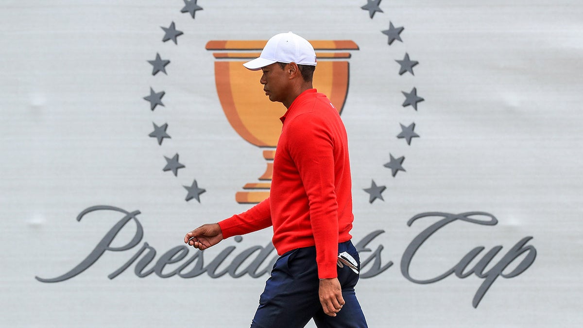 Tiger Woods the playing captain of the United States Team walks to the first tee during the final day singles matches in the 2019 Presidents Cup at Royal Melbourne Golf Club on Dec. 15, 2019 in Melbourne, Australia.