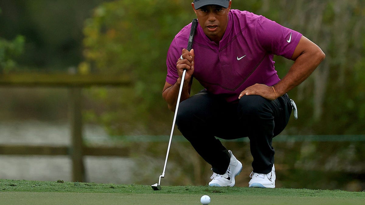 Tiger Woods lines up a putt during the PNC Championship at the Ritz Carlton Golf Club on Dec. 19, 2020, in Orlando, Florida. 