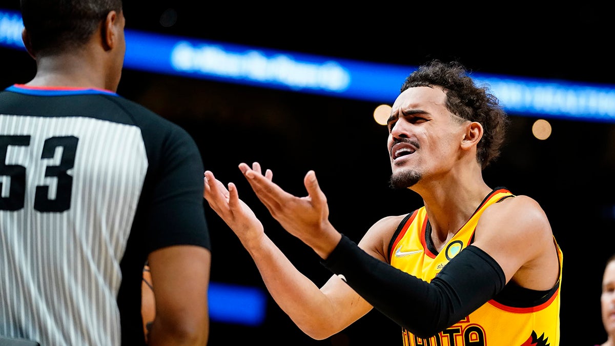 Atlanta Hawks guard Trae Young reacts after a call during the first half of the team's NBA basketball game against the Utah Jazz on Thursday, Nov. 4, 2021, in Atlanta.