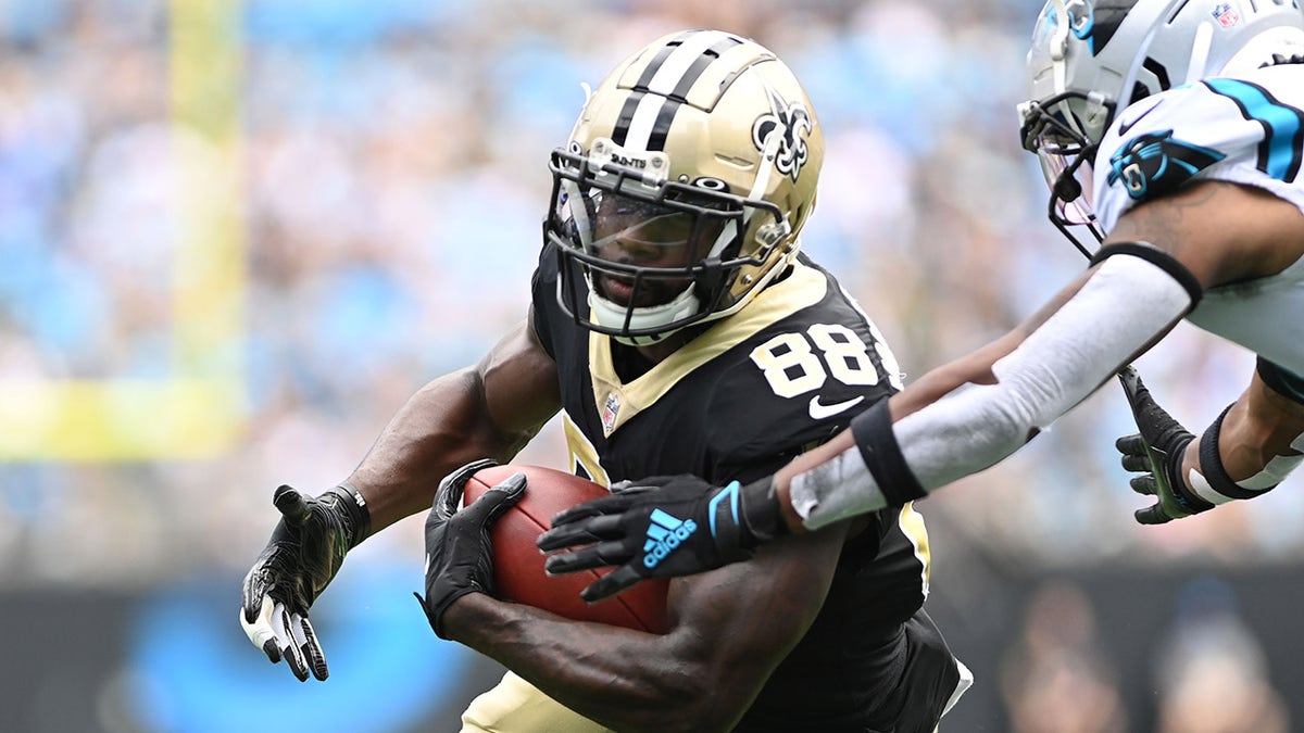 Sep 19, 2021; Charlotte, North Carolina, USA;  New Orleans Saints wide receiver Ty Montgomery (88) with the ball as Carolina Panthers cornerback Juston Burris (31) defends in the third quarter at Bank of America Stadium.
