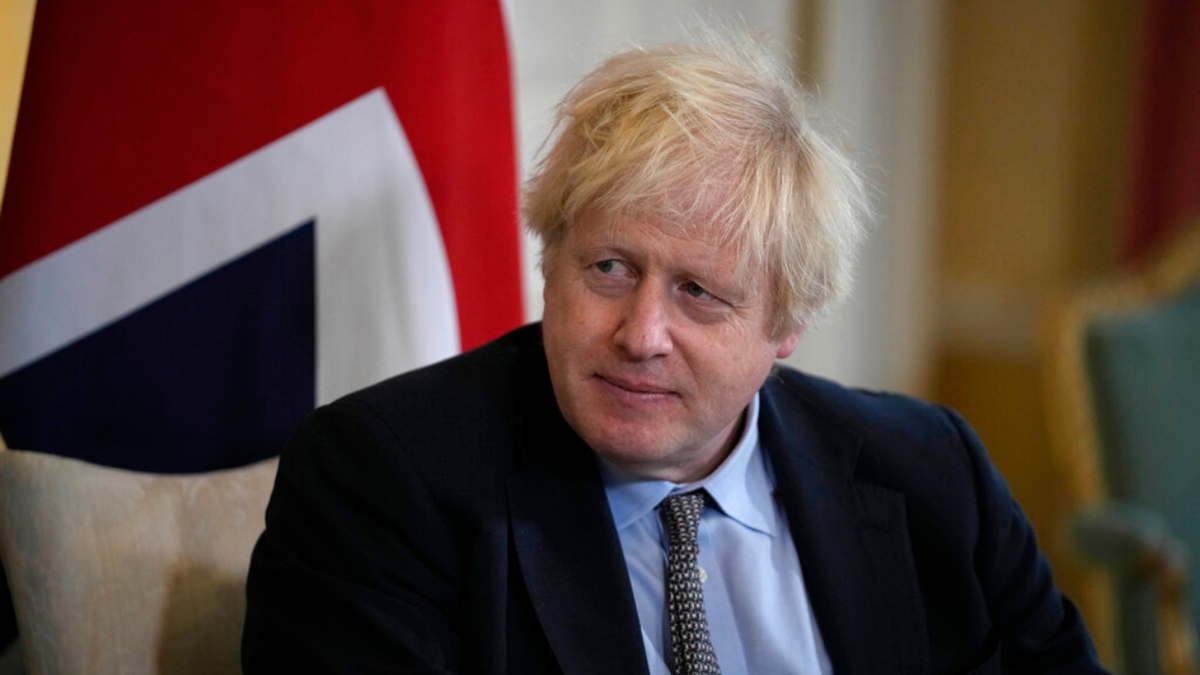 British Prime Minister Boris Johnson listens to Polish Prime Minister Mateusz Morawiecki at the start of their meeting inside 10 Downing Street, in London, Friday, Nov. 26, 2021