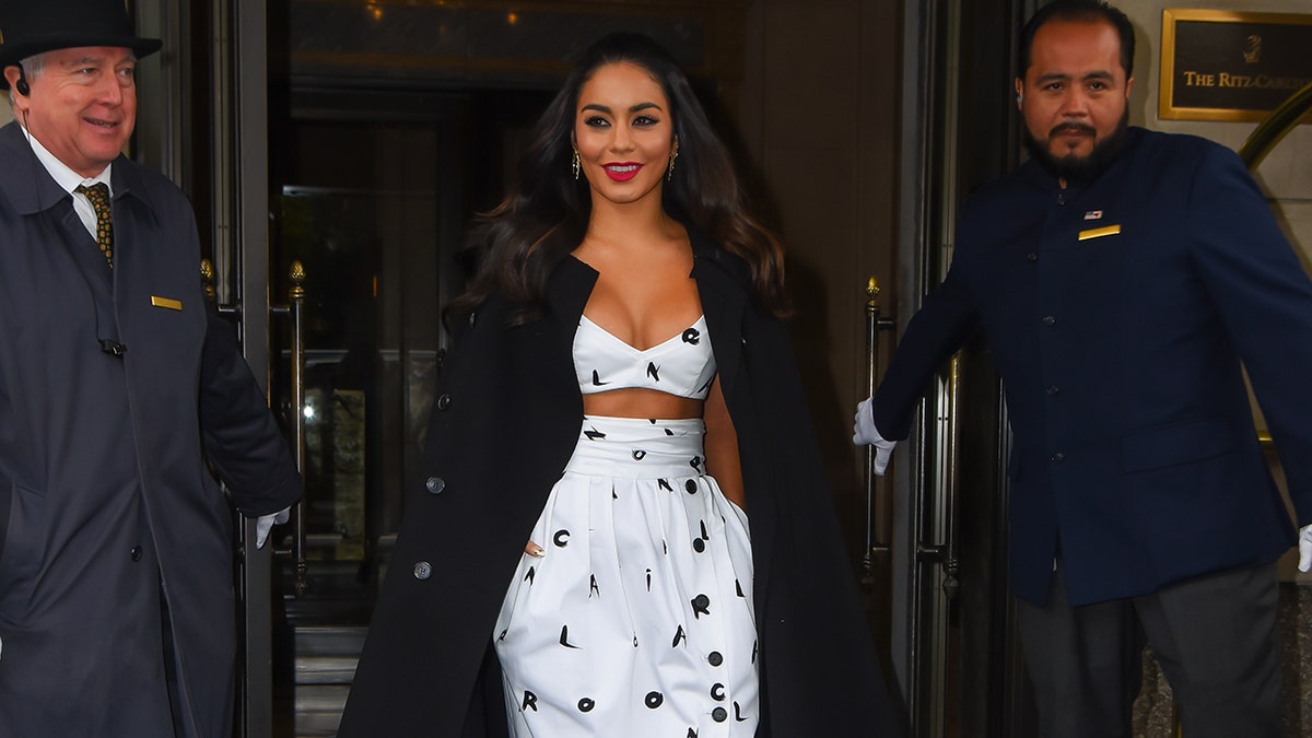 Vanessa Hudgens seen in Manhattan sporting a Valentino overcoat and black-and-white look from the Carolina Herrera Spring 2022 collection.