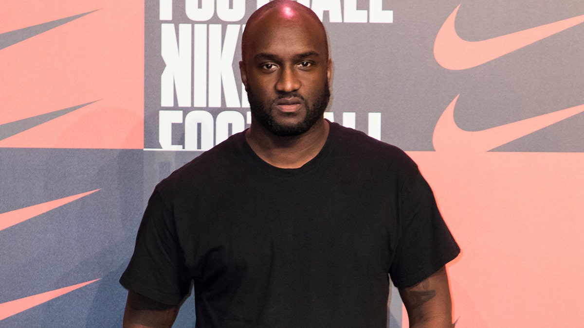 Virgil Abloh poses for photographers upon arrival at the Nike Celebrates The Beautiful Game event, in London on Wednesday, Feb. 7, 2018. Abloh, a leading fashion executive hailed as the Karl Lagerfeld of his generation, has died after a private battle with cancer. He was 41.