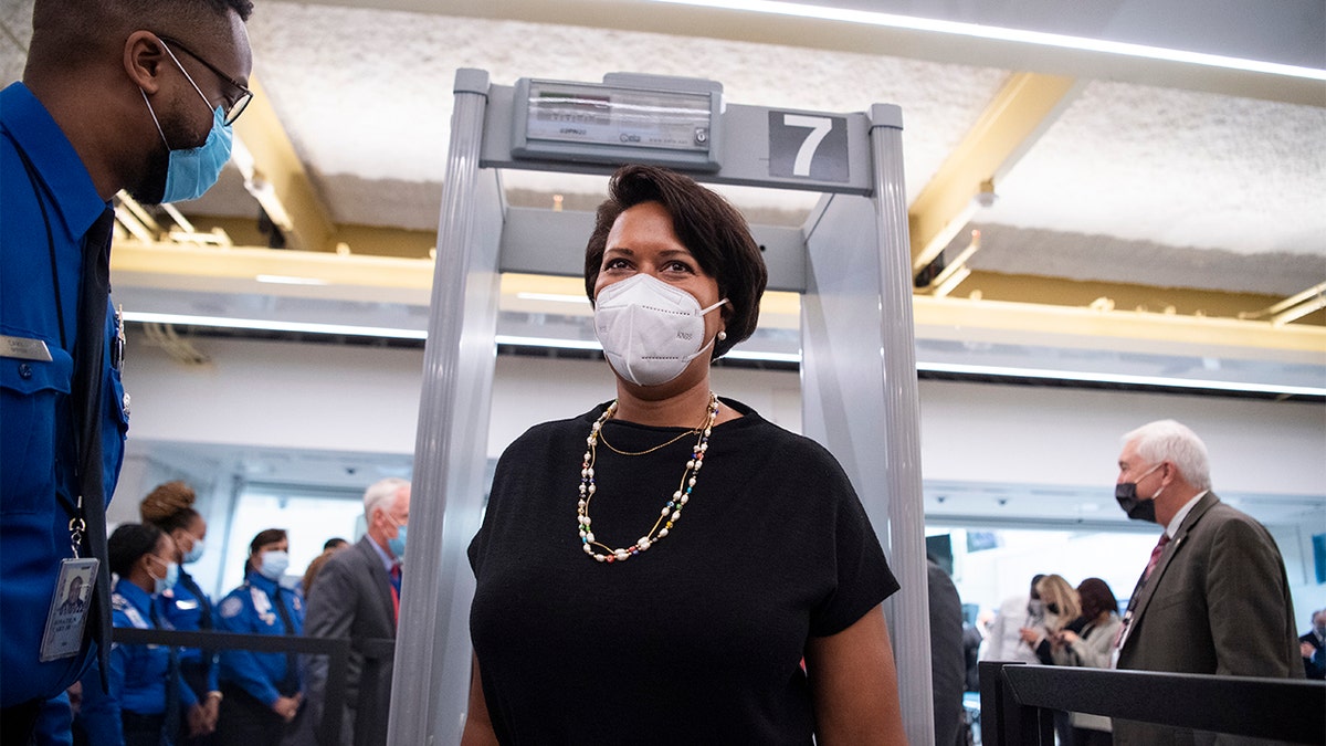D.C. Mayor Muriel Bowser is screened during a dedication ceremony for Project Journey, a new 14-gate concourse to replace Gate 35x and two new security checkpoints, at Reagan National Airport in Arlington, Va., on Wednesday, Oct. 13, 2021. (Photo By Tom Williams/CQ-Roll Call, Inc via Getty Images)
