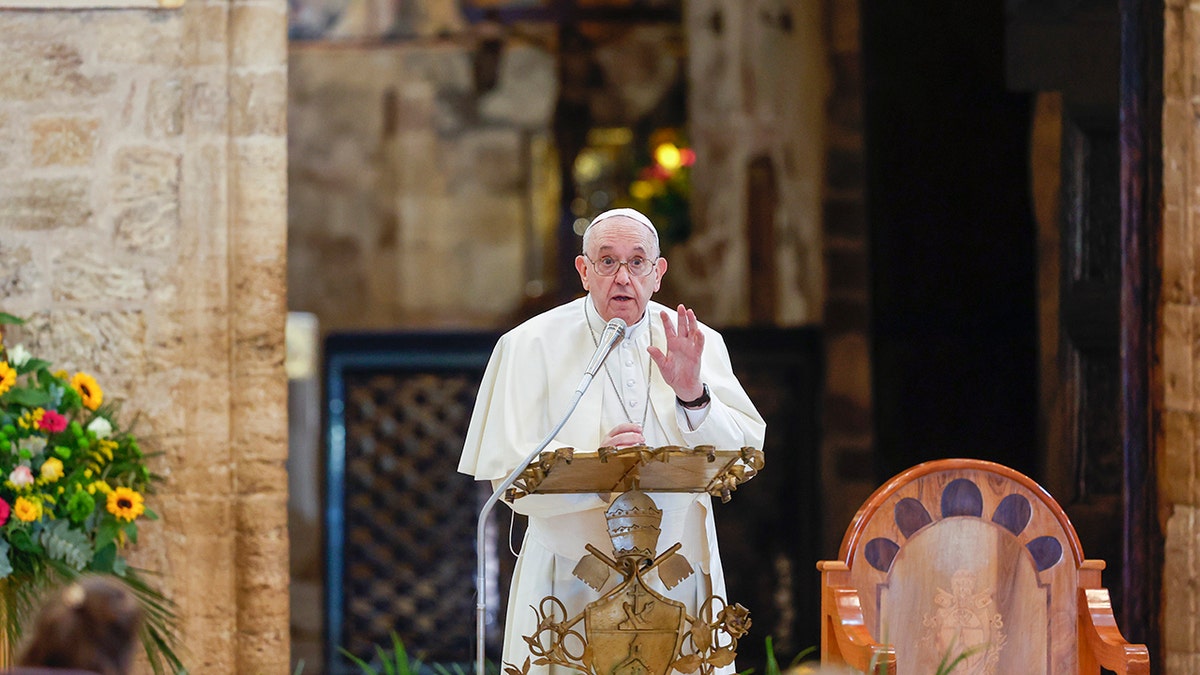 Pope Francis attends a meeting of listening and prayer inside the Basilica of Santa Maria degli Angeli in Assisi, central Italy on Friday.?