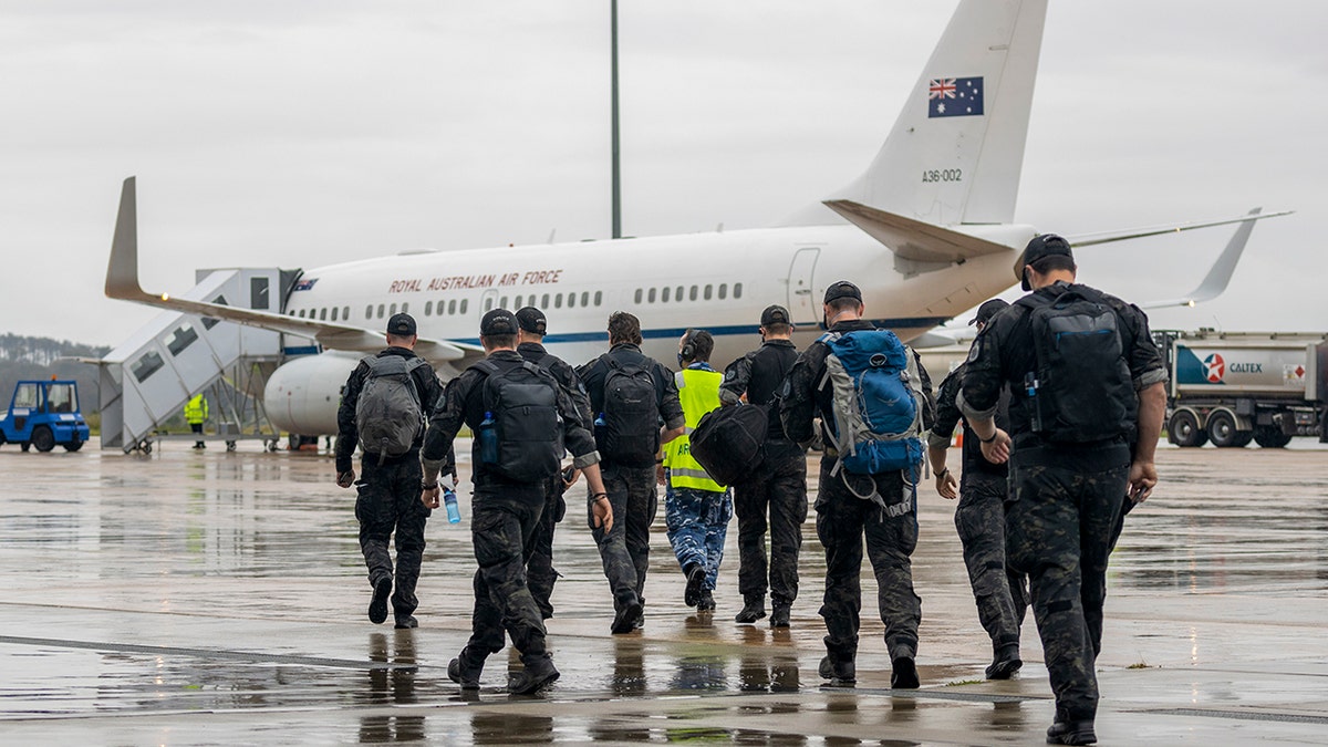 Australian Federal Police Special Operations members prepare to depart Canberra, Australia, for the Solomon Islands on a Royal Australian Air Force jet on Thursday, Nov. 25, 2021. 