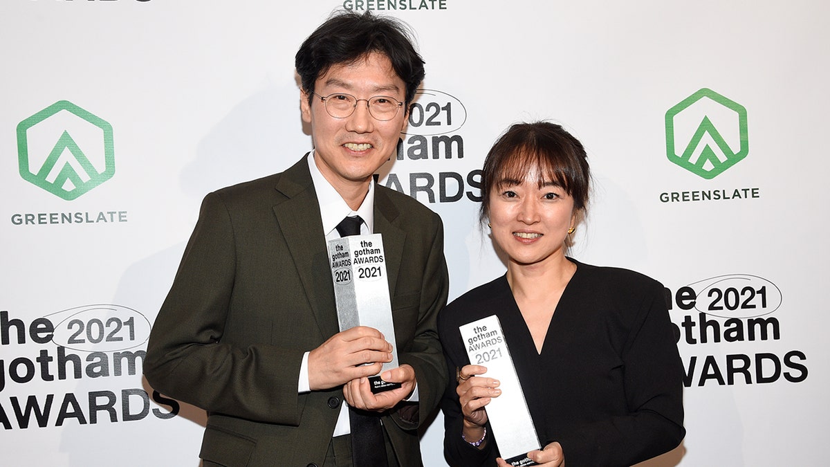 Kwang Dong-hyuk, left, and Kim Ji-yeon pose with the breakthrough series–long format award at the Gotham Awards on Monday, Nov. 29, 2021, in New York. 