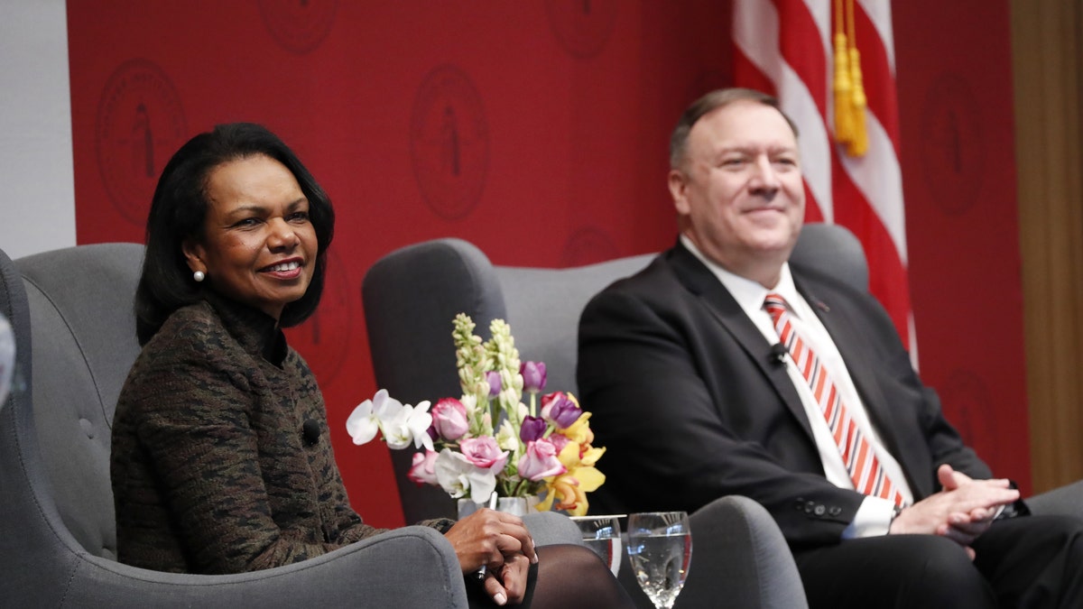 Condoleezza Rice, former U.S. secretary of state, and Mike Pompeo, U.S. secretary of state, right, listen during an event hosted by the Hoover Institution at Stanford University in Stanford, California, U.S., on Monday, Jan. 13, 2020. Photographer: John G. Mabanglo/EPA/Bloomberg via Getty Images
