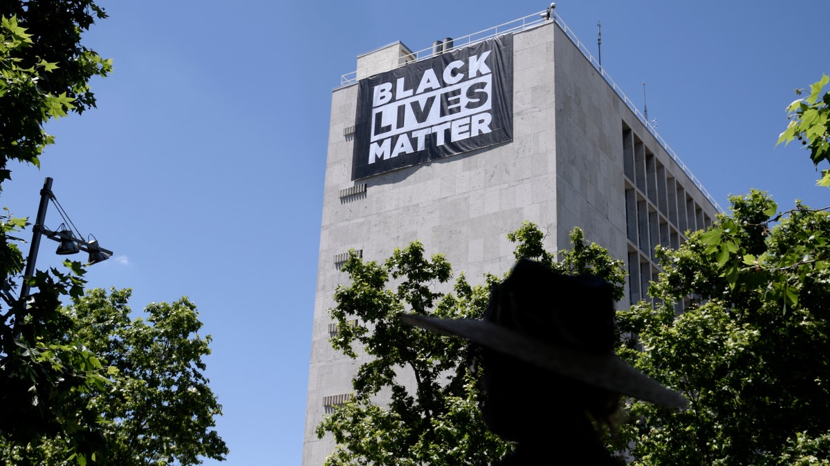 A Black Lives Matter banner hangs above the US Embassy in Spain