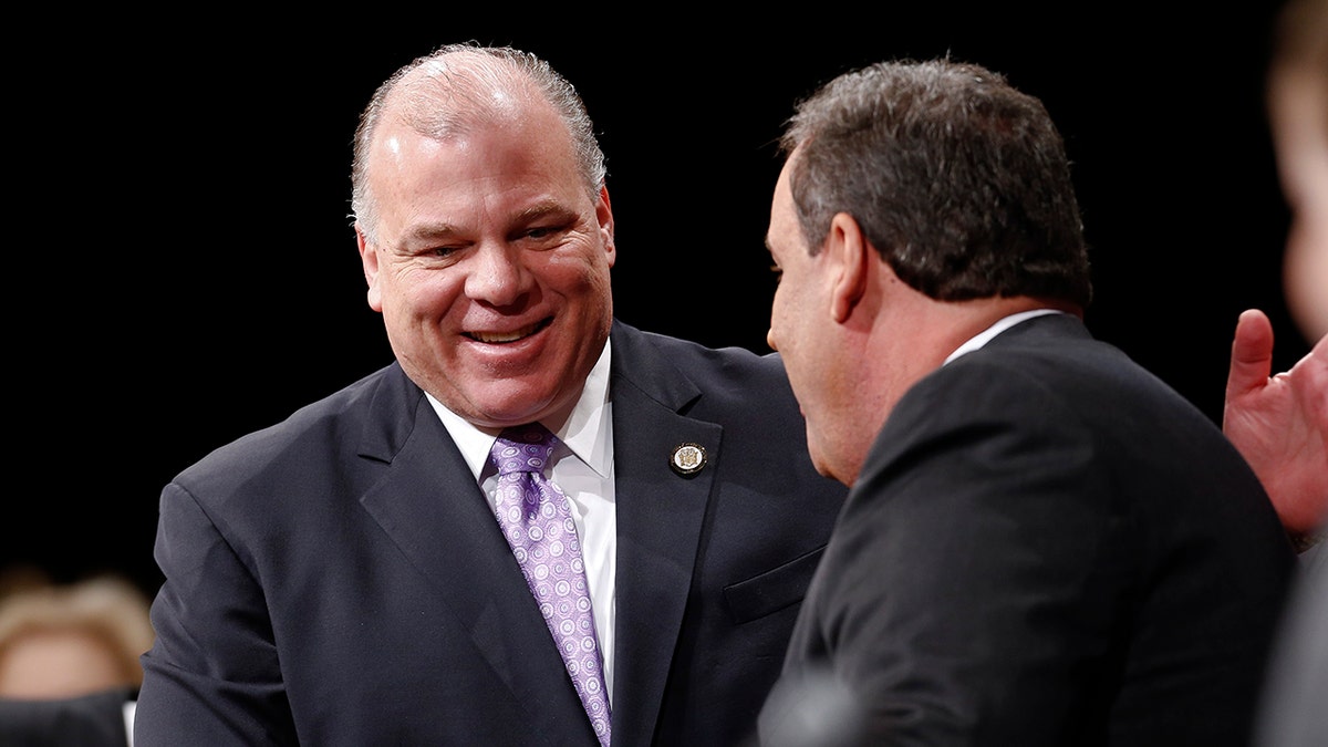TRENTON, NJ - JANUARY 21:  New Jersey Senate President Steve Sweeney greets New Jersey Gov. Chris Christie prior to being sworn in for his second term on January 21, 2014 at the War Memorial in Trenton, New Jersey. (Photo by Jeff Zelevansky/Getty Images)