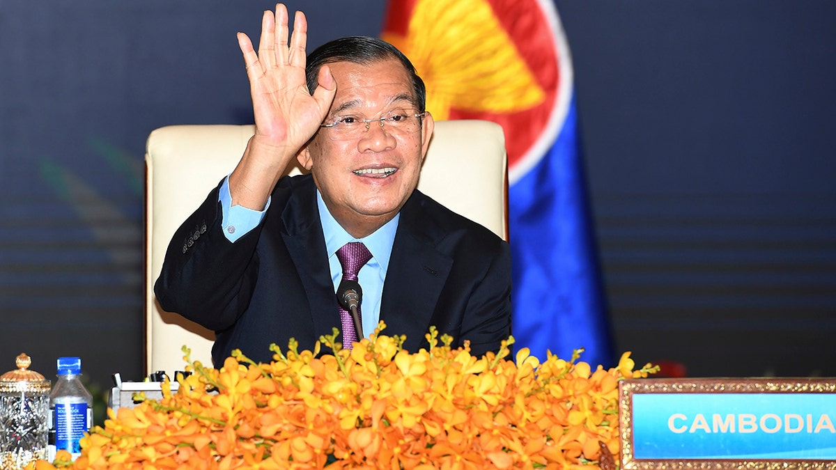 In this photo provided by An Khoun Sam Aun/National Television of Cambodia, Cambodian Prime Minister Hun Sen gestures as he joins an online meeting of the ASEAN-China special summit at Peace Palace in Phnom Penh, Cambodia, Monday, Nov. 22, 2021. 