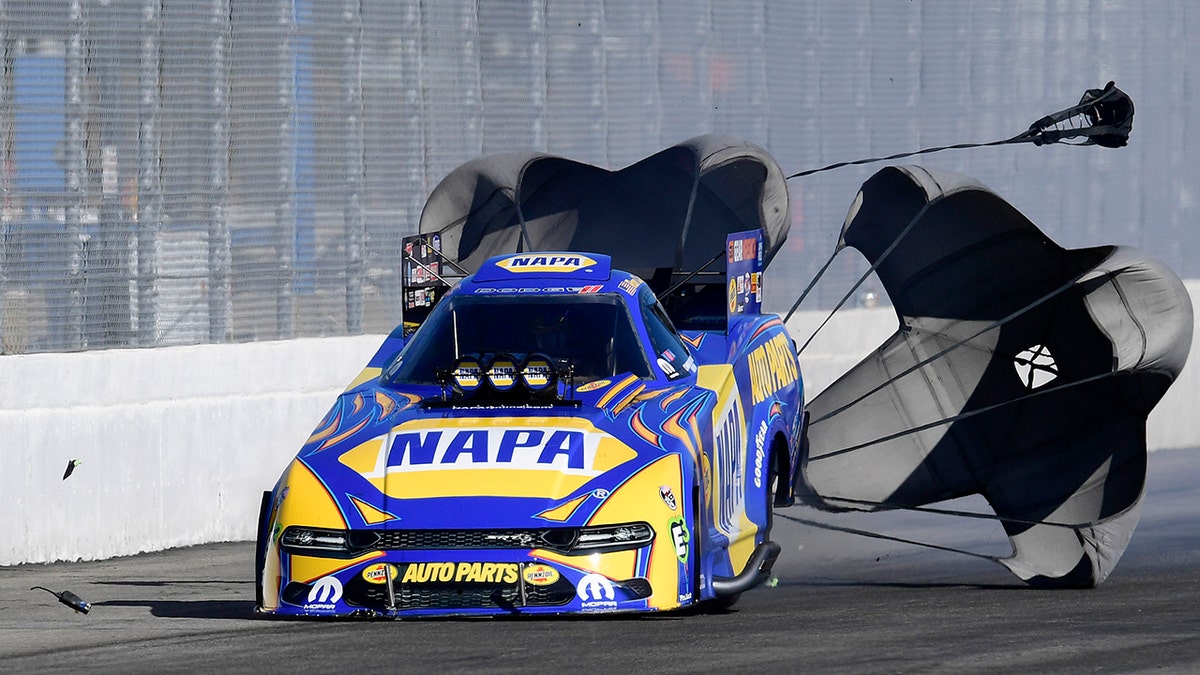 A radio bounced down the track after falling off of Ron Capps Funny Car during the first round of eliminations.